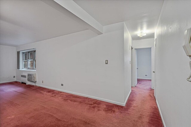 144-55Melbourne Ave 2F, Flushing, NY 11367 - empty room with carpet floors, radiator heating unit, and an AC wall unit