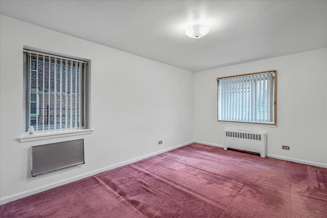 144-55Melbourne Ave 2F, Flushing, NY 11367 - empty room with radiator heating unit and carpet flooring