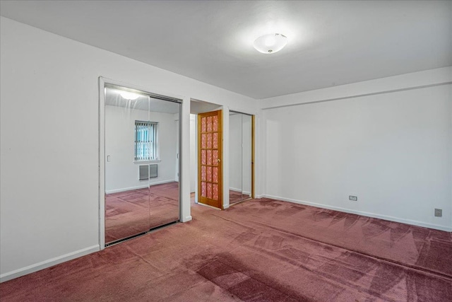 144-55Melbourne Ave 2F, Flushing, NY 11367 - unfurnished bedroom featuring carpet flooring and two closets