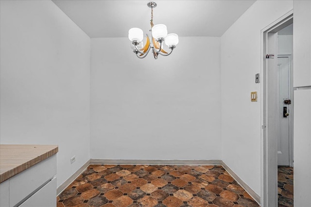 144-55Melbourne Ave 2F, Flushing, NY 11367 - unfurnished dining area with a chandelier and baseboards
