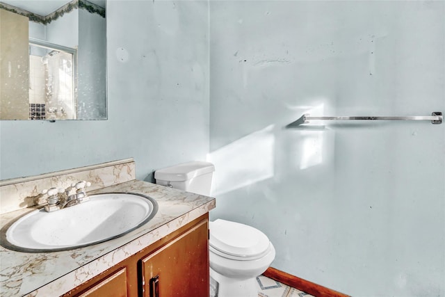 bathroom featuring vanity and toilet