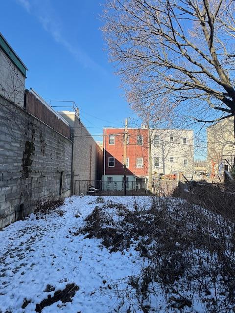 view of yard covered in snow