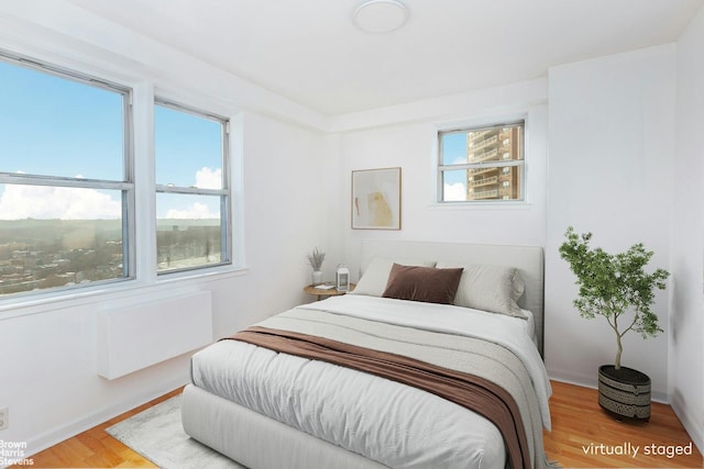 bedroom with wood-type flooring