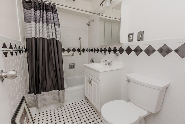 full bathroom with shower / bath combo, vanity, tile walls, tile patterned flooring, and toilet