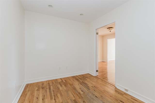 unfurnished room with light wood-type flooring