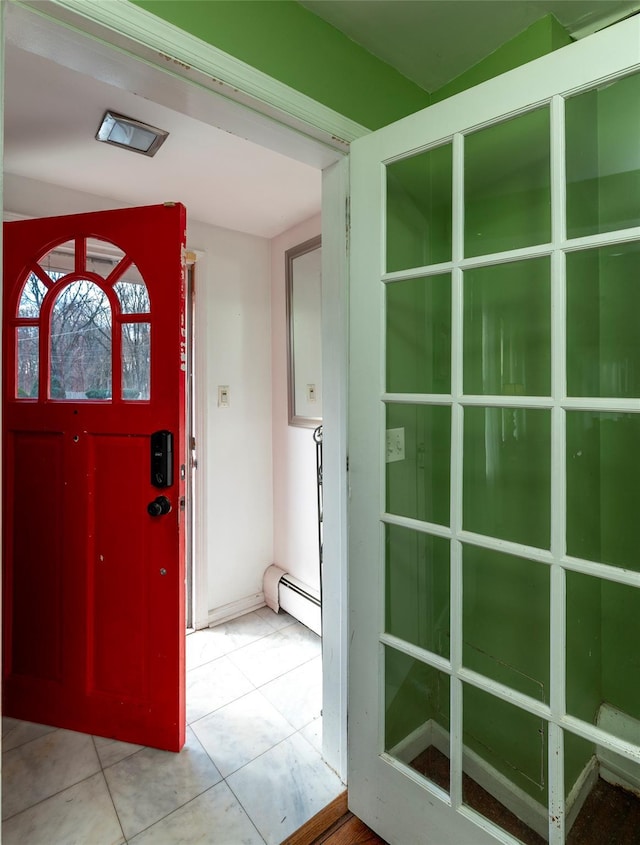 tiled foyer entrance with baseboard heating