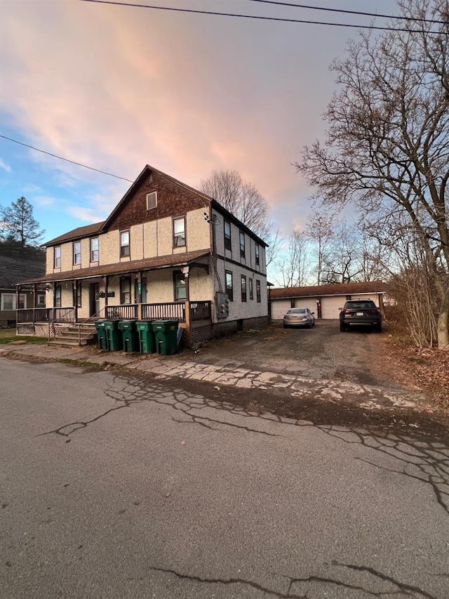 view of front of home with a porch and a garage