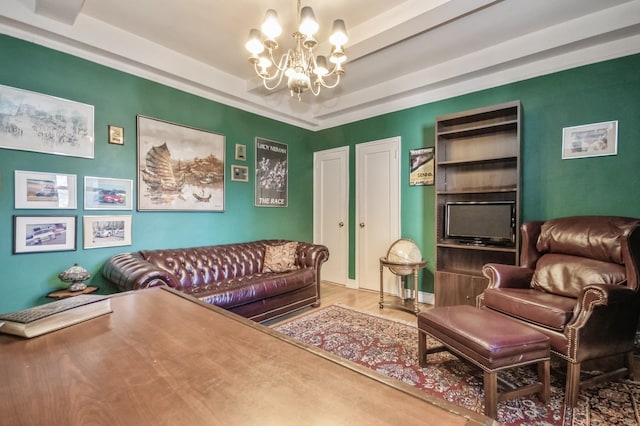 living area featuring a chandelier, hardwood / wood-style floors, and a tray ceiling