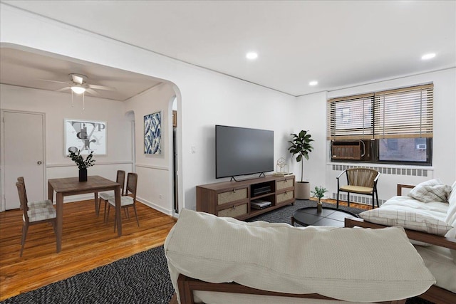 living room featuring hardwood / wood-style flooring and ceiling fan