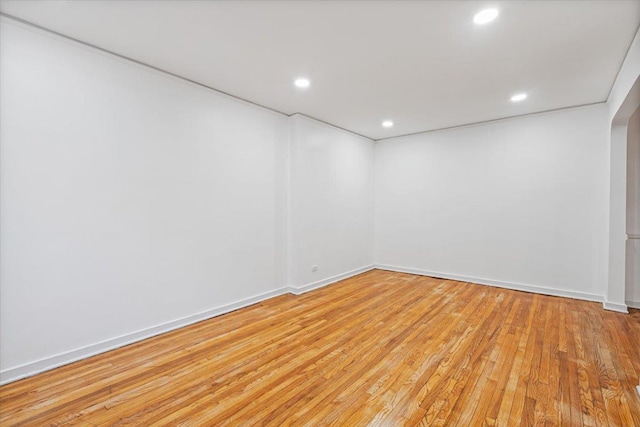 spare room with light hardwood / wood-style flooring