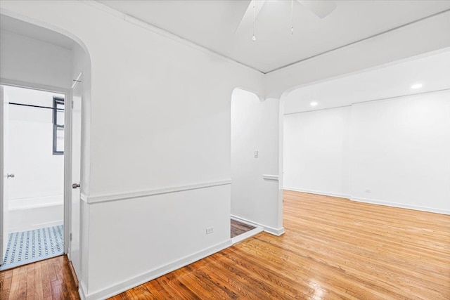 unfurnished room featuring ceiling fan and wood-type flooring