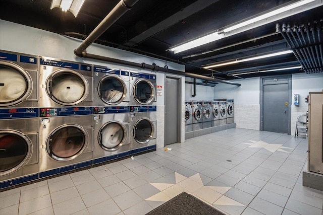 clothes washing area featuring stacked washing maching and dryer and independent washer and dryer