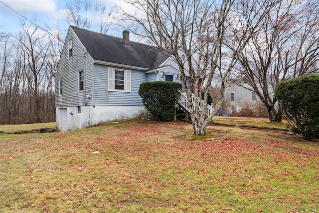 view of home's exterior featuring a lawn