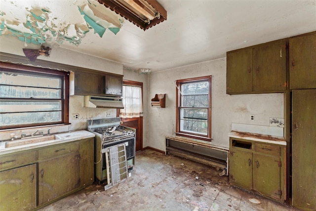 kitchen with ventilation hood, white gas range, and sink