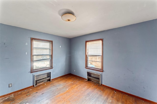 spare room with light hardwood / wood-style flooring