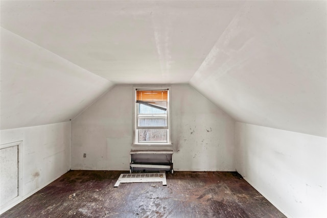 additional living space featuring lofted ceiling