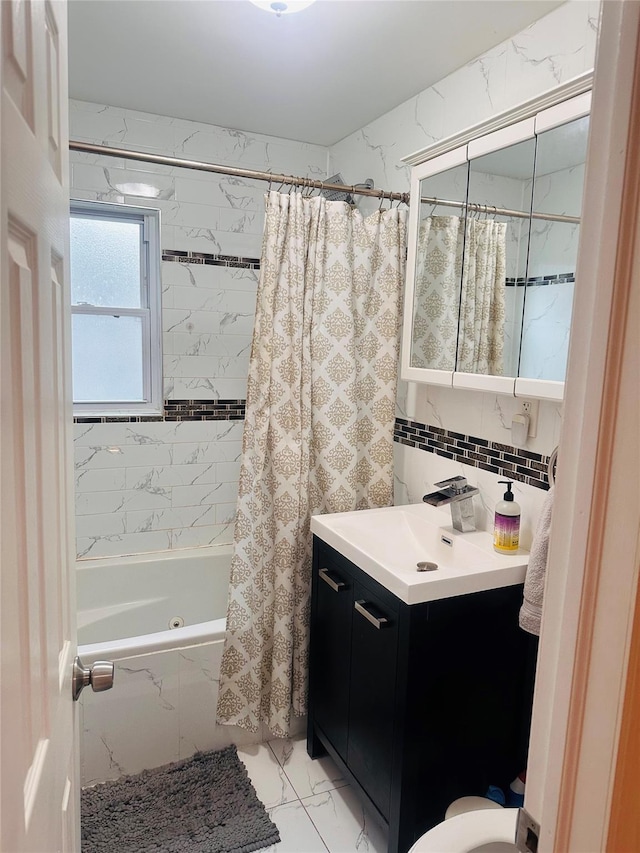 bathroom featuring vanity and shower / tub combo