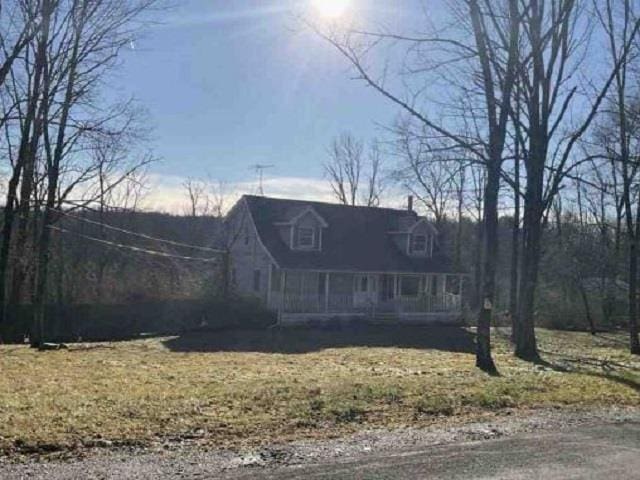 847 Greenville Tpke, Middletown, NY 10940 - cape cod home featuring covered porch and a front lawn