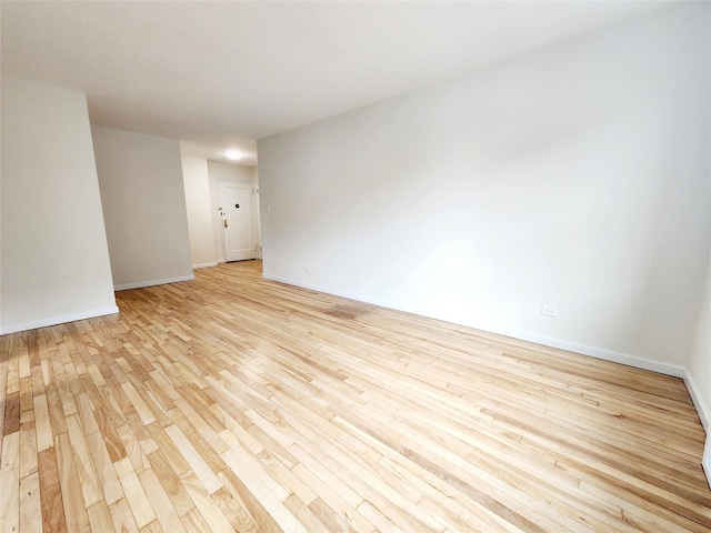 spare room with light hardwood / wood-style floors