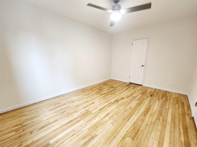 unfurnished room with ceiling fan and light wood-type flooring