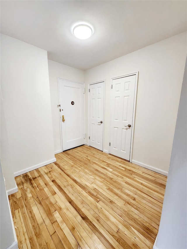 spare room with light wood-type flooring