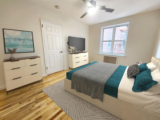 bedroom featuring ceiling fan and light wood-type flooring