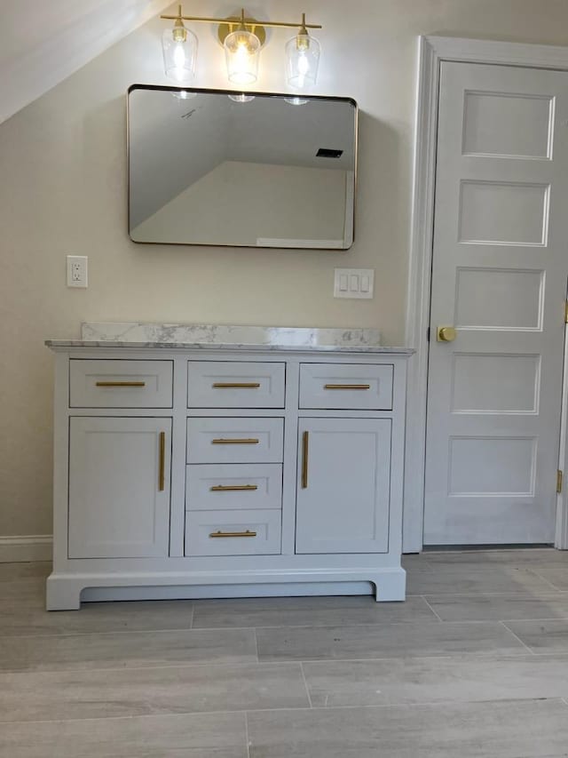 bathroom featuring hardwood / wood-style floors and vanity