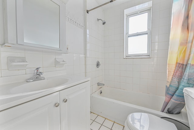 full bathroom with vanity, tile patterned flooring, decorative backsplash, toilet, and shower / bath combo with shower curtain