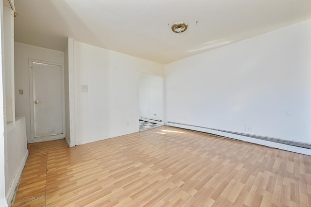 spare room featuring light hardwood / wood-style flooring