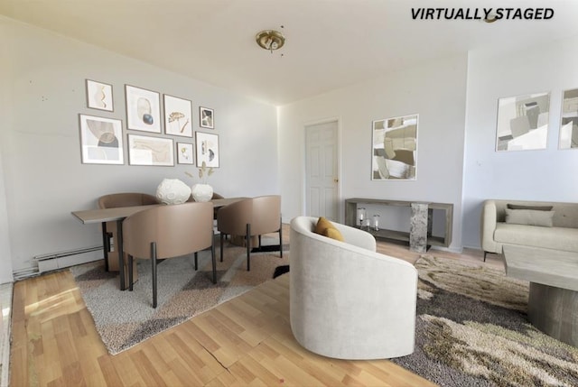 interior space featuring hardwood / wood-style flooring and baseboard heating