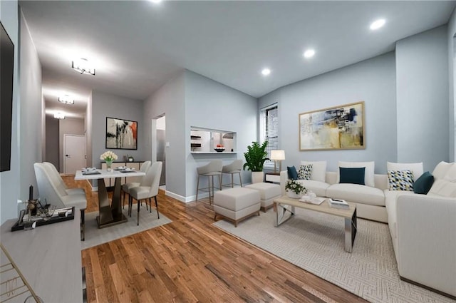 living room with light hardwood / wood-style flooring