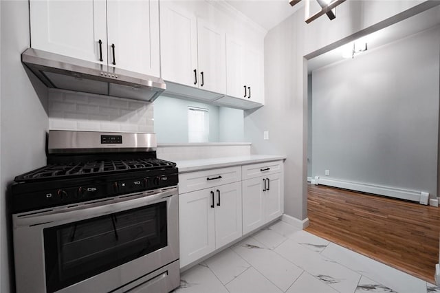 kitchen with backsplash, baseboard heating, light hardwood / wood-style floors, white cabinetry, and stainless steel range with gas stovetop