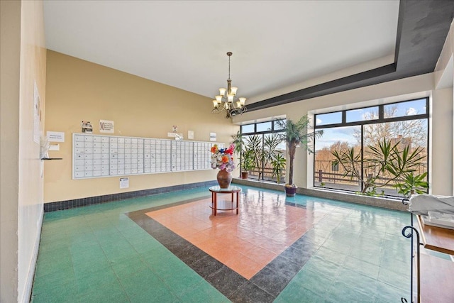 view of pool with a chandelier and mail boxes