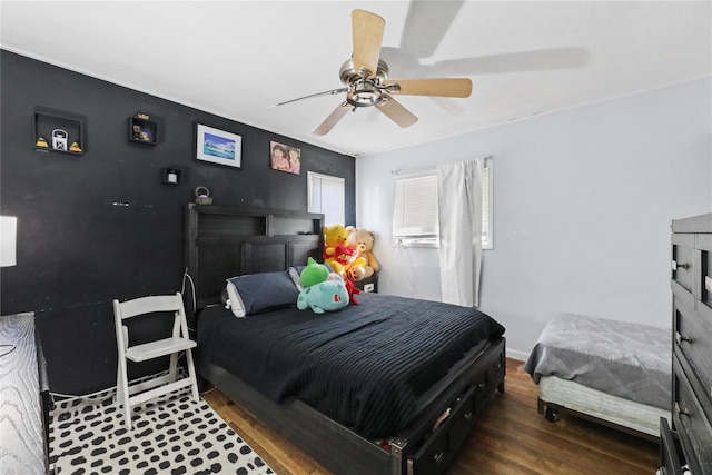 bedroom featuring hardwood / wood-style floors and ceiling fan