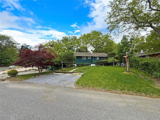 33 Birch Ct, Riverhead, NY 11901 - view of front of home with driveway and a front yard