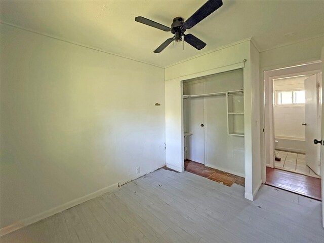33 Birch Ct, Riverhead, NY 11901 - unfurnished bedroom featuring light wood-style flooring, a closet, and baseboards