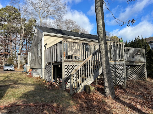 rear view of house featuring a deck