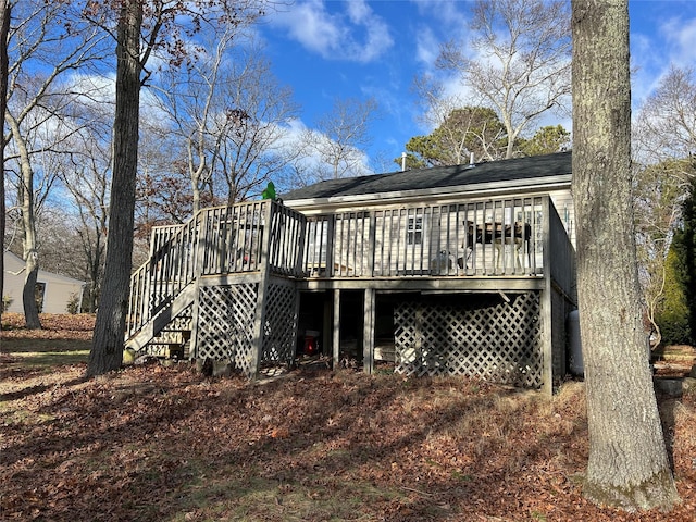 rear view of house featuring a deck