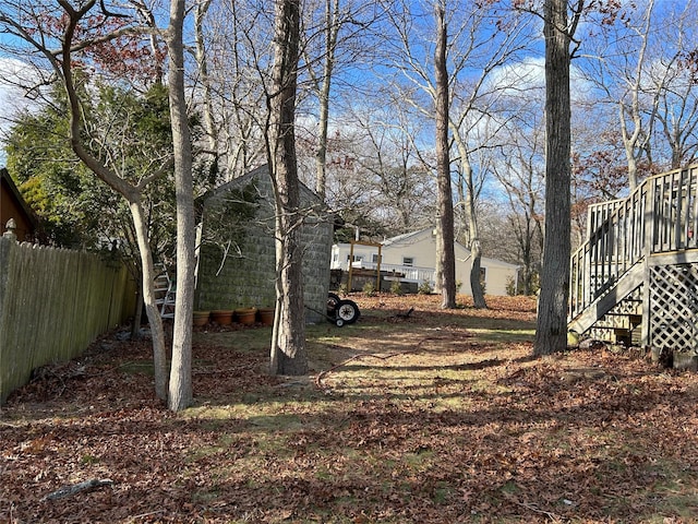 view of yard featuring a wooden deck