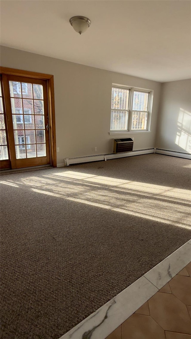 spare room with tile patterned flooring and a baseboard radiator