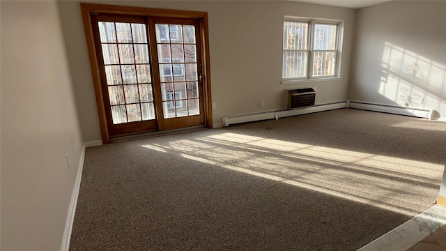 carpeted spare room with a wall mounted air conditioner and a baseboard radiator