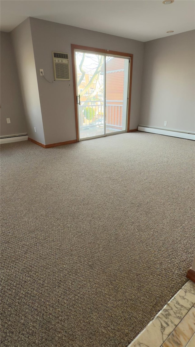 unfurnished room featuring carpet flooring, a wall mounted AC, and baseboard heating