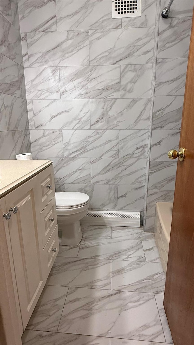 bathroom featuring walk in shower, vanity, and toilet