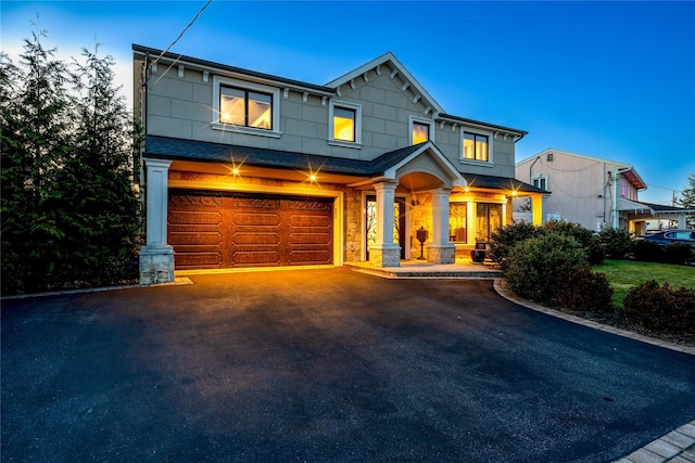 craftsman inspired home with a garage