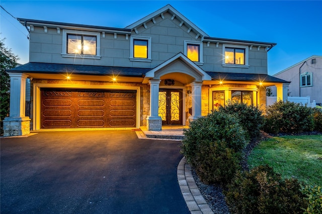 view of front of property featuring a garage