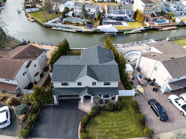 birds eye view of property featuring a water view