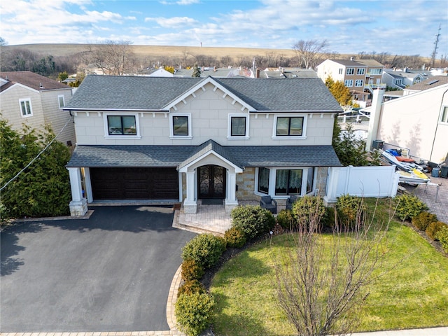 view of front of home featuring french doors and a garage