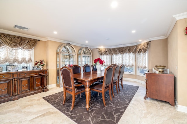 dining room featuring ornamental molding