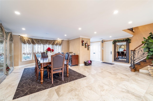 dining space featuring crown molding