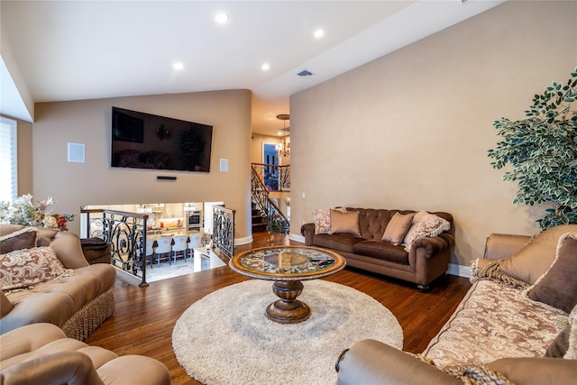 living room featuring dark wood-type flooring and lofted ceiling